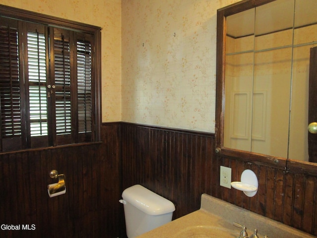 16 Knickerbocker Rd, Scotia, NY 12302 - bathroom with wallpapered walls, a wainscoted wall, healthy amount of natural light, and vanity