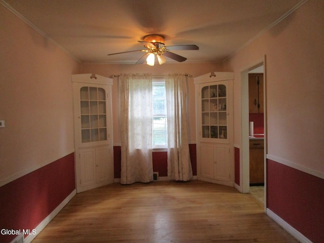 16 Knickerbocker Rd, Scotia, NY 12302 - unfurnished dining area featuring ornamental molding, a ceiling fan, and light wood-type flooring