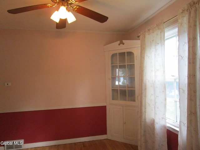 16 Knickerbocker Rd, Scotia, NY 12302 - spare room featuring a ceiling fan, wood finished floors, and ornamental molding