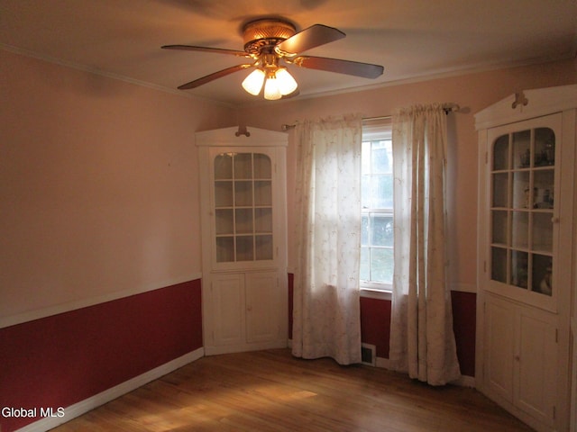 16 Knickerbocker Rd, Scotia, NY 12302 - unfurnished room with a ceiling fan, light wood-style floors, healthy amount of natural light, and crown molding