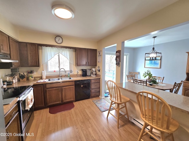 kitchen with stainless steel electric range oven, plenty of natural light, dishwasher, and light wood-style floors
