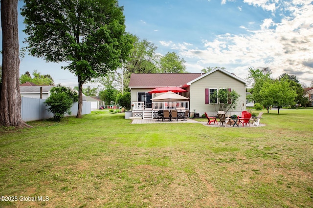 9 Barton Ave, Fort Edward, NY 12828 - rear view of property featuring a deck, an outdoor fire pit, a patio area, a gazebo, and a detached garage