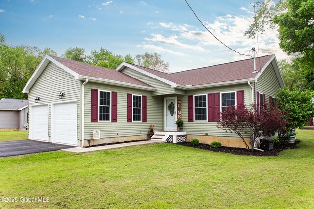 9 Barton Ave, Fort Edward, NY 12828 - ranch-style house featuring a front lawn, a shingled roof, and asphalt driveway