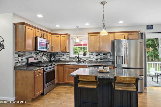9 Barton Ave, Fort Edward, NY 12828 - kitchen featuring stainless steel appliances, a sink, light wood-style floors, decorative backsplash, and recessed lighting