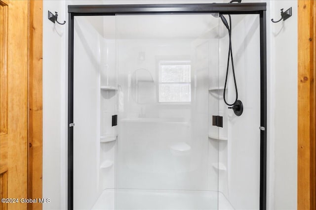 bathroom featuring a shower stall