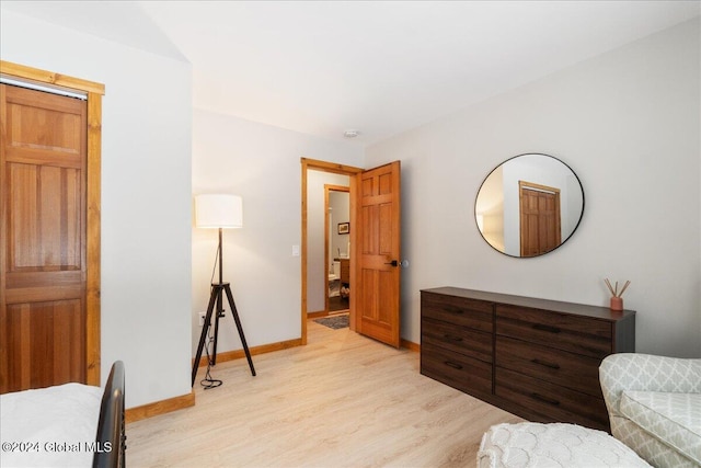 interior space featuring light wood-style flooring and baseboards