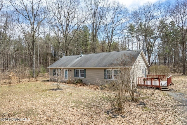 view of front of house featuring a wooden deck