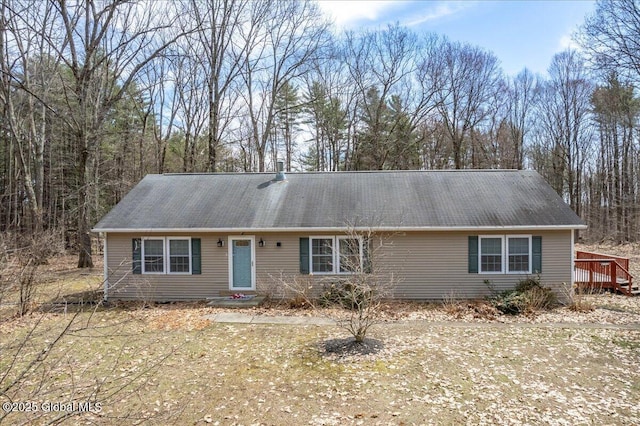 ranch-style house with a deck