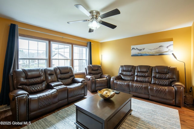 living room with a ceiling fan and wood finished floors