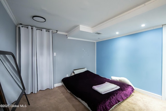 bedroom with visible vents, baseboards, crown molding, and carpet floors