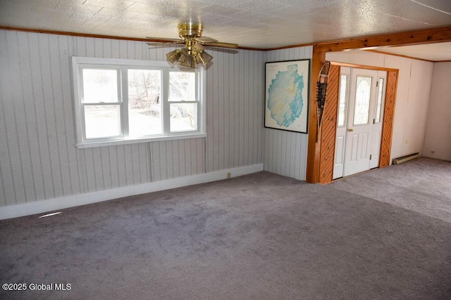 interior space featuring carpet floors, a ceiling fan, plenty of natural light, and baseboard heating