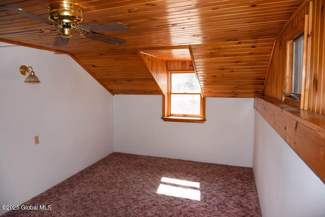 bonus room featuring ceiling fan, wooden ceiling, carpet, and vaulted ceiling