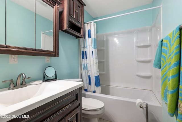 bathroom featuring shower / bath combo with shower curtain, toilet, and vanity