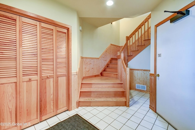 132 County Highway 152 Unit C, Northville, NY 12134 - stairs with wainscoting, tile patterned flooring, wood walls, and recessed lighting