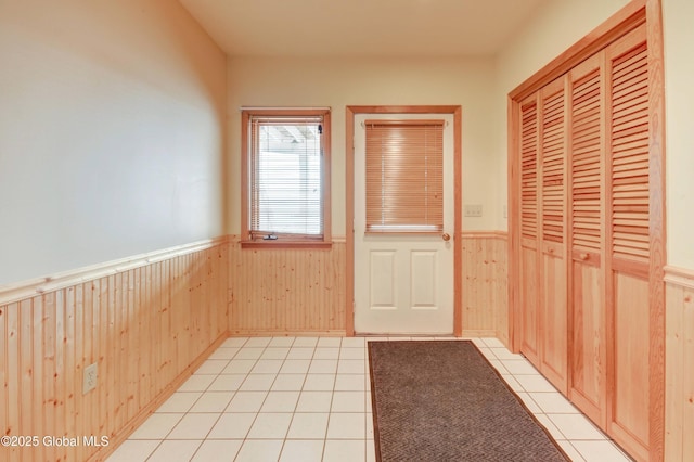 132 County Highway 152 Unit C, Northville, NY 12134 - entryway featuring wainscoting, wood walls, and light tile patterned flooring