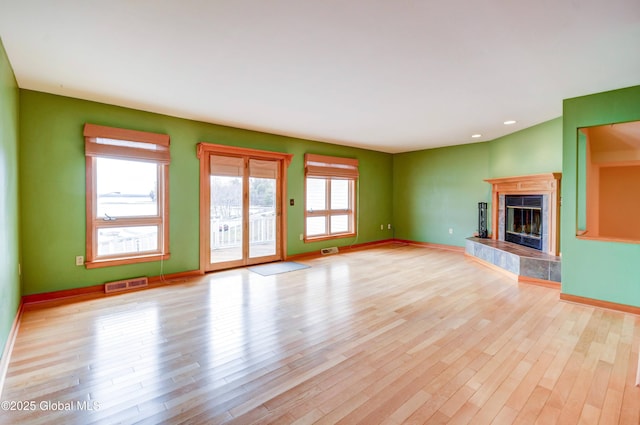 132 County Highway 152 Unit C, Northville, NY 12134 - unfurnished living room with a fireplace, wood finished floors, and recessed lighting
