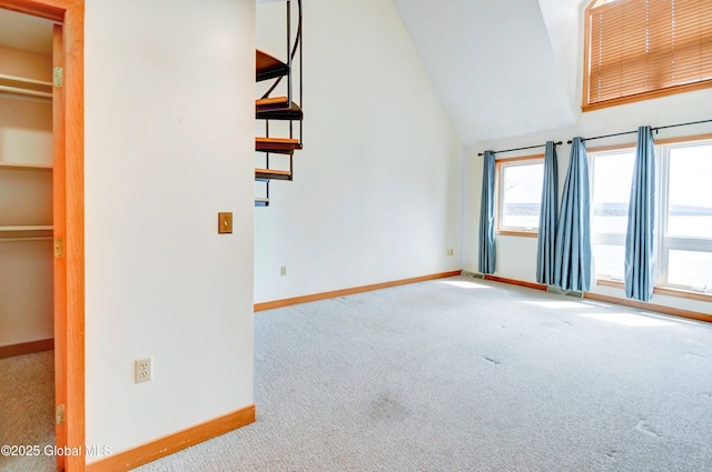 132 County Highway 152 Unit C, Northville, NY 12134 - unfurnished living room with carpet floors and vaulted ceiling