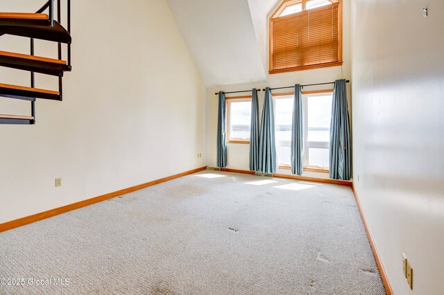 132 County Highway 152 Unit C, Northville, NY 12134 - carpeted spare room featuring baseboards and vaulted ceiling