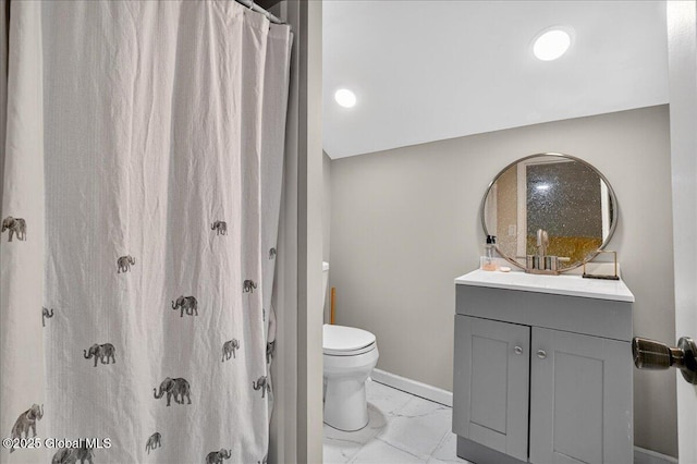 458 Central Ave, Niskayuna, NY 12304 - full bathroom with marble look tile flooring, toilet, vanity, and baseboards