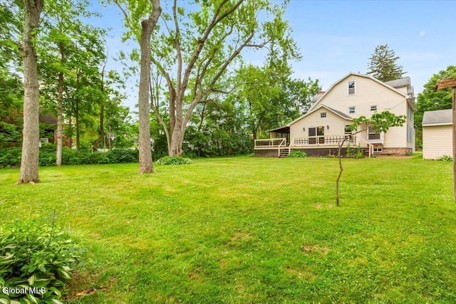 104 Euclid Ave, Altamont, NY 12009 - view of grassy yard with a deck