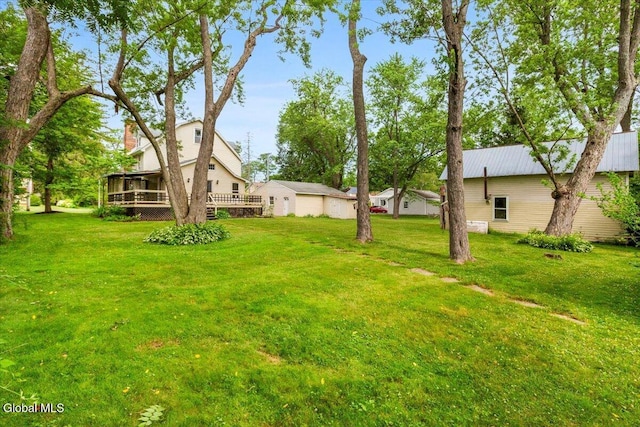 104 Euclid Ave, Altamont, NY 12009 - view of grassy yard with a deck and a sunroom