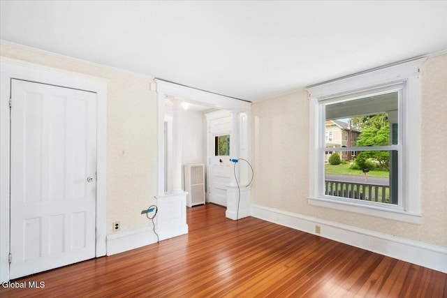 104 Euclid Ave, Altamont, NY 12009 - unfurnished bedroom with decorative columns and wood finished floors