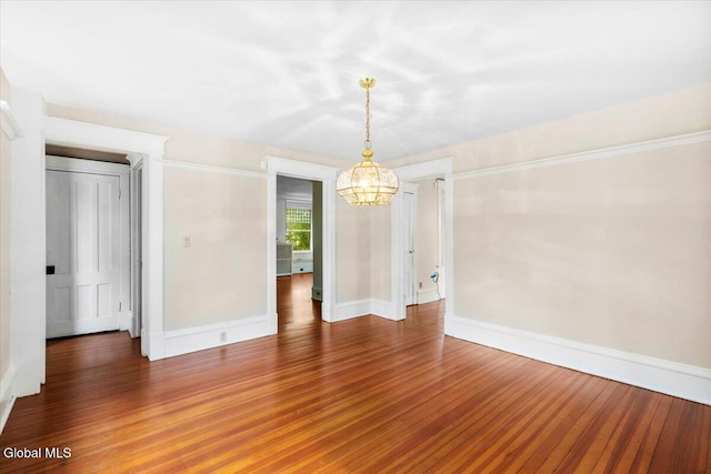 104 Euclid Ave, Altamont, NY 12009 - spare room featuring a chandelier and wood finished floors