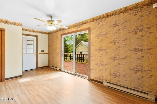 104 Euclid Ave, Altamont, NY 12009 - spare room featuring a baseboard radiator, wood finished floors, and ceiling fan