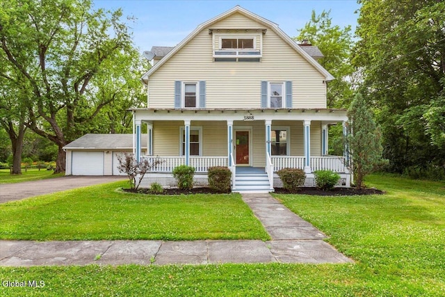 104 Euclid Ave, Altamont, NY 12009 - view of front facade with covered porch, a detached garage, and a front yard