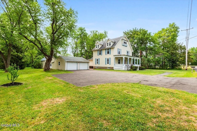 104 Euclid Ave, Altamont, NY 12009 - view of front of house featuring an outdoor structure, a detached garage, and a front lawn