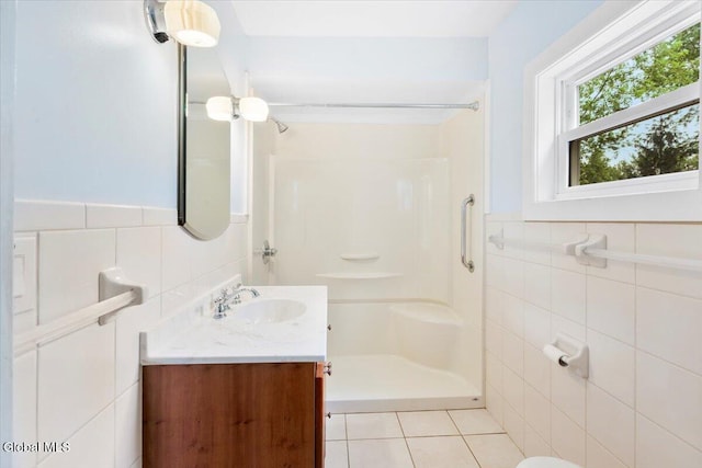 104 Euclid Ave, Altamont, NY 12009 - bathroom featuring tile walls, a shower stall, vanity, and a wainscoted wall