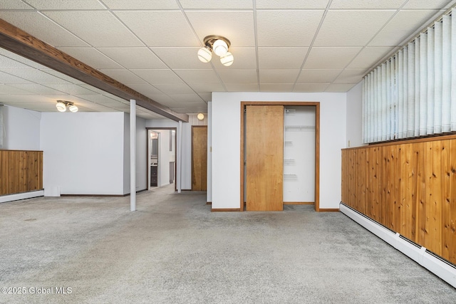 interior space with a baseboard radiator, carpet flooring, and baseboards