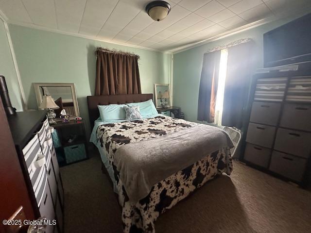 2543 Moriah Rd, Moriah, NY 12960 - carpeted bedroom with crown molding