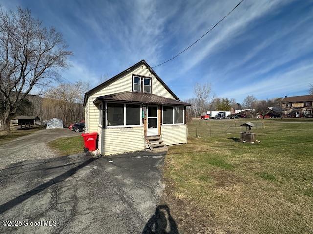 2543 Moriah Rd, Moriah, NY 12960 - bungalow with entry steps and a front lawn