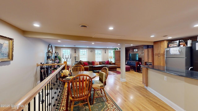 dining area featuring recessed lighting, visible vents, light wood-type flooring, and baseboards