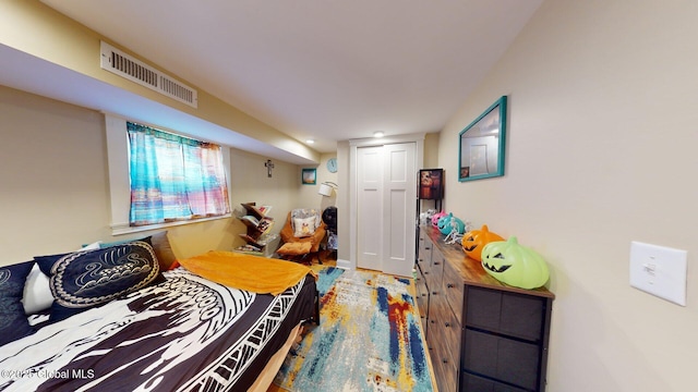 bedroom featuring visible vents and a closet