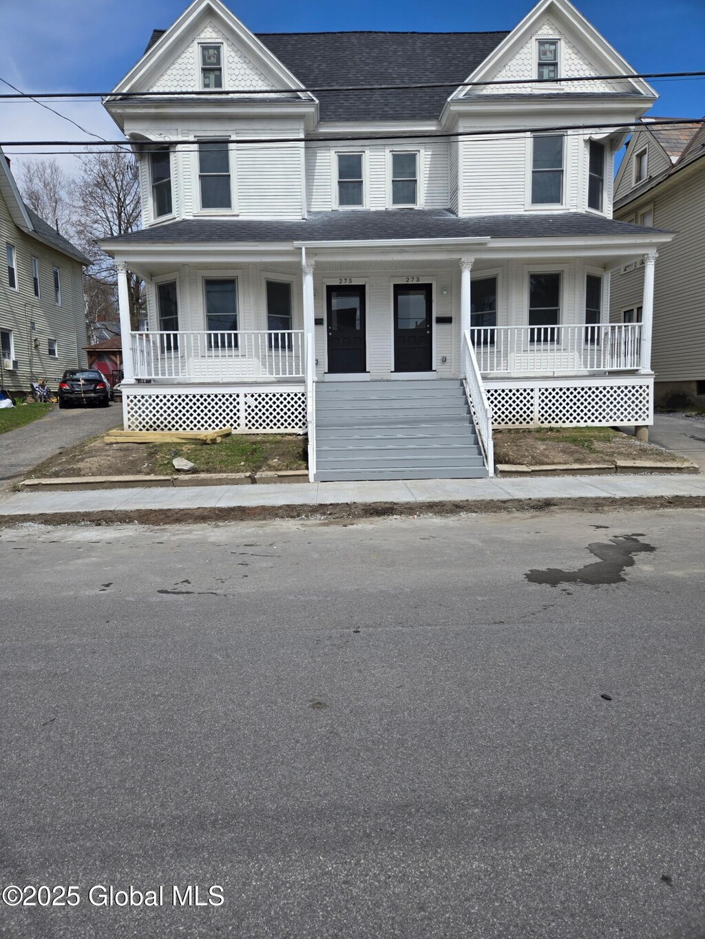273-275 Division St, Amsterdam, NY 12010 - view of front facade featuring roof with shingles and covered porch