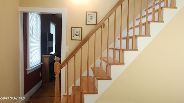 stairway featuring plenty of natural light