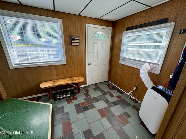 16 Pumphouse Rd, Lake Luzerne, NY 12846 - foyer featuring wood walls, dark floors, and a healthy amount of sunlight