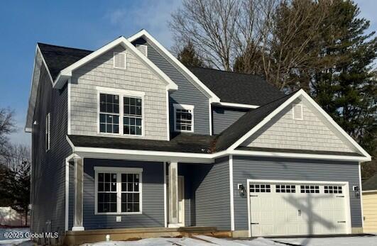 view of front of home with an attached garage and driveway