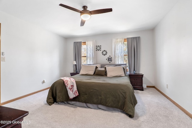 bedroom featuring carpet floors, baseboards, and ceiling fan