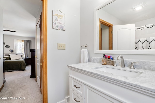 ensuite bathroom featuring vanity and ensuite bath