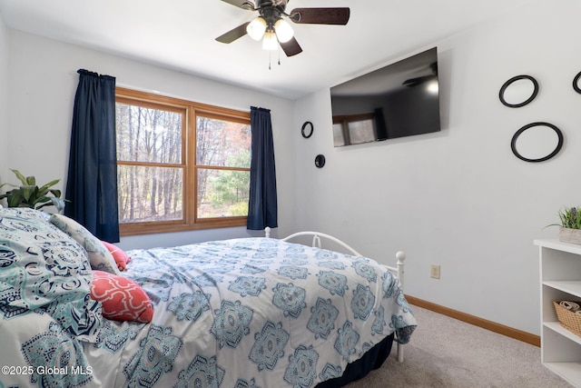 bedroom featuring baseboards, a ceiling fan, and carpet floors