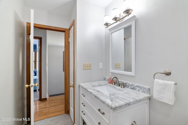bathroom featuring vanity and wood finished floors
