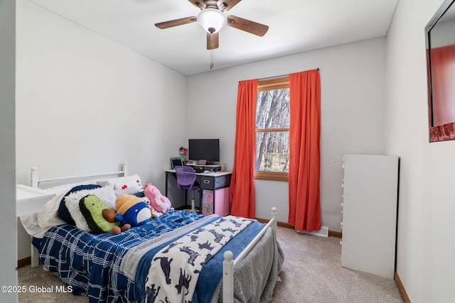 bedroom featuring baseboards, ceiling fan, and carpet flooring