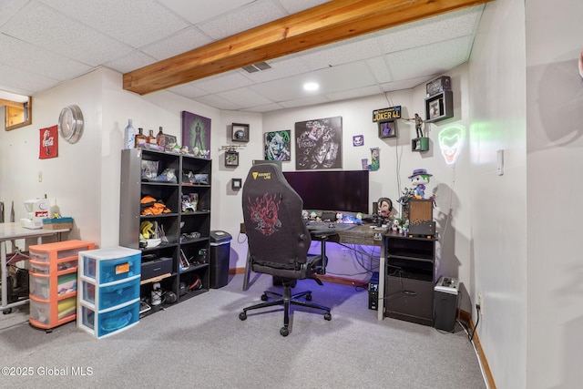 carpeted office featuring visible vents and a paneled ceiling