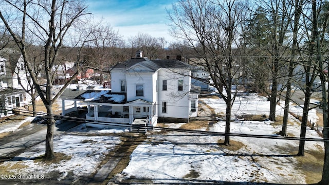 view of front of house featuring a chimney