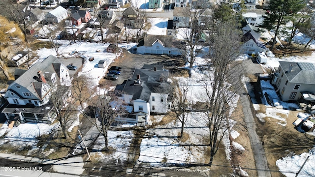 snowy aerial view featuring a residential view
