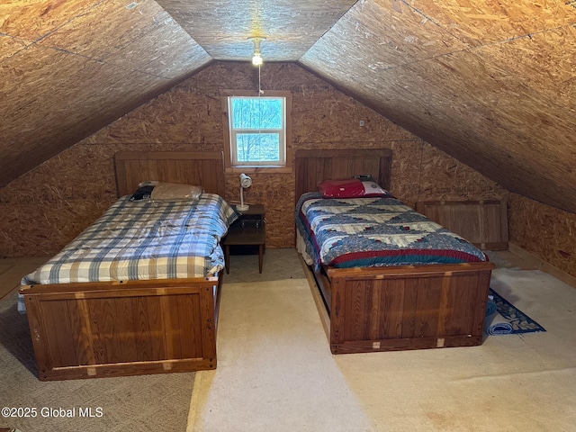carpeted bedroom with vaulted ceiling