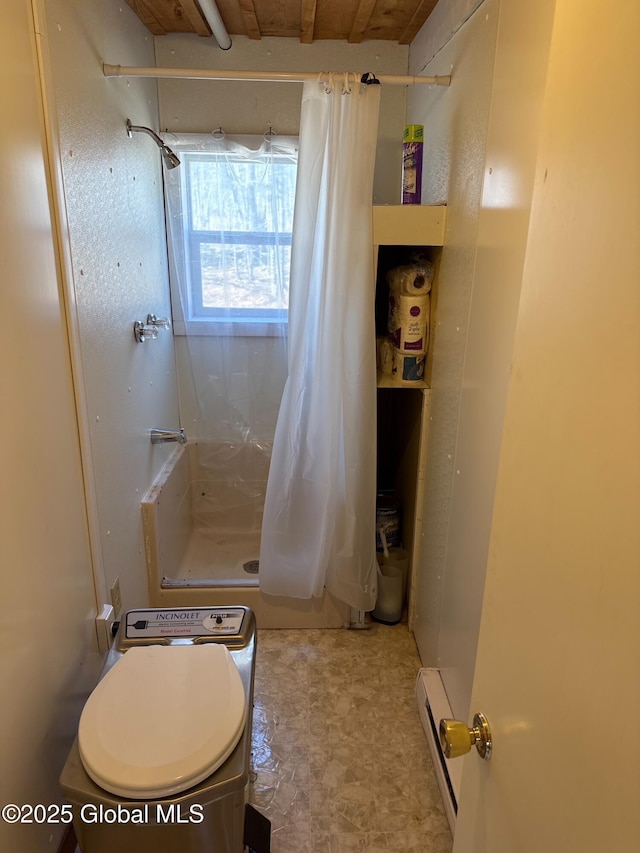 bathroom with toilet, a baseboard radiator, and a stall shower